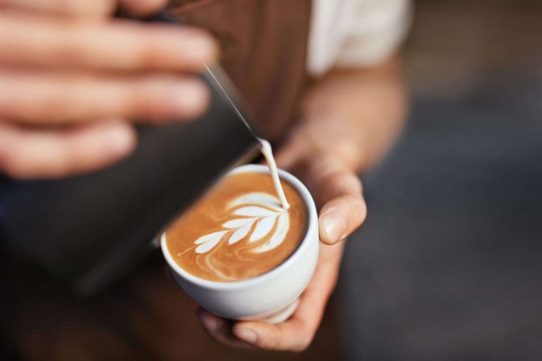 Barista pouring coffee