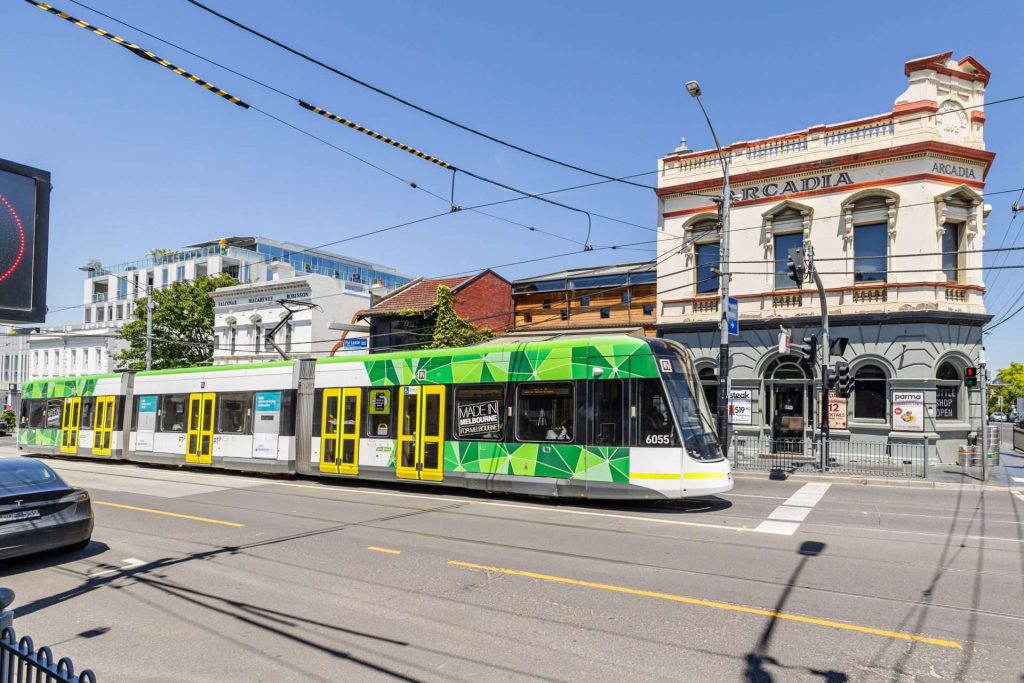 Arcadia Hotel South Yarra with a tram running past.