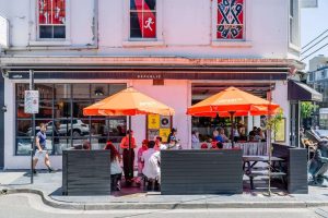 Colourful orange umbrellas outside Republica Cafe South Yarra