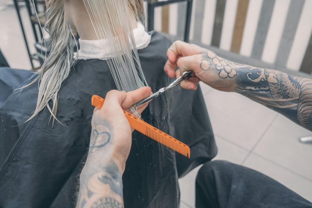 hairdresser cutting a woman's hair