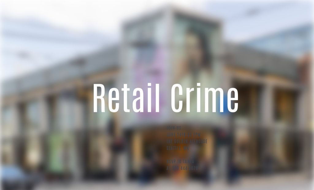 Blurred image of shopping area with Retail Crime wording overlaid on image