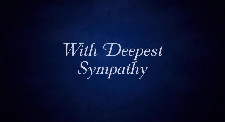 Dark blue tile with With Deepest Sympathy in white script